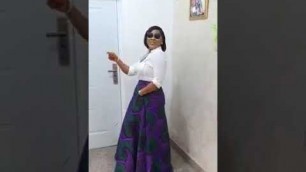 'Dancing Nigerian Fashion Designer, ADEEVA, in a formal shirt and Ankara combo'
